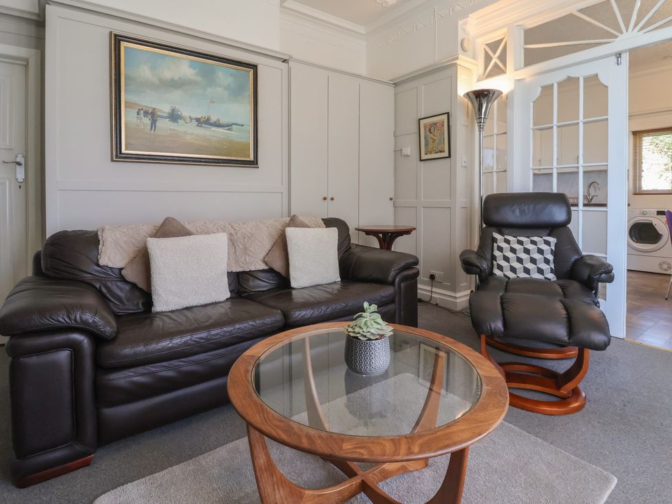 A living room with a sofa and armchair at Sandy Shore in Bridlington