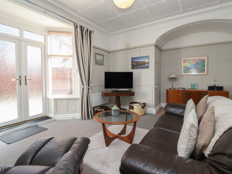 A living room with television and coffee table at Sandy Shore in Bridlington