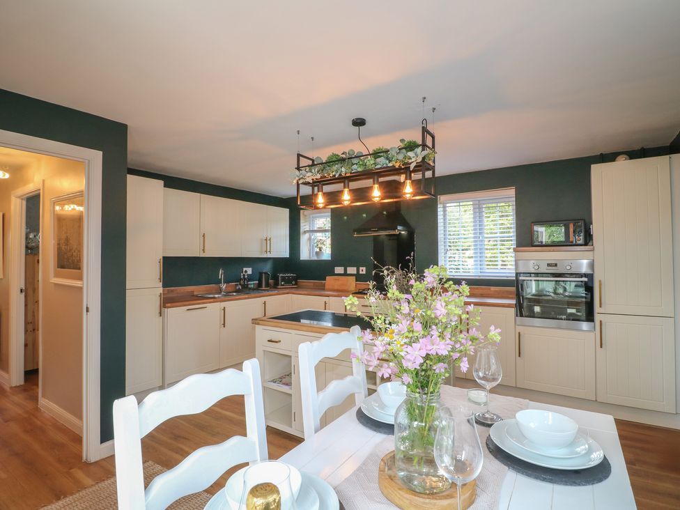 A kitchen with dining area and appliances at 7 Yarnfield Parkway