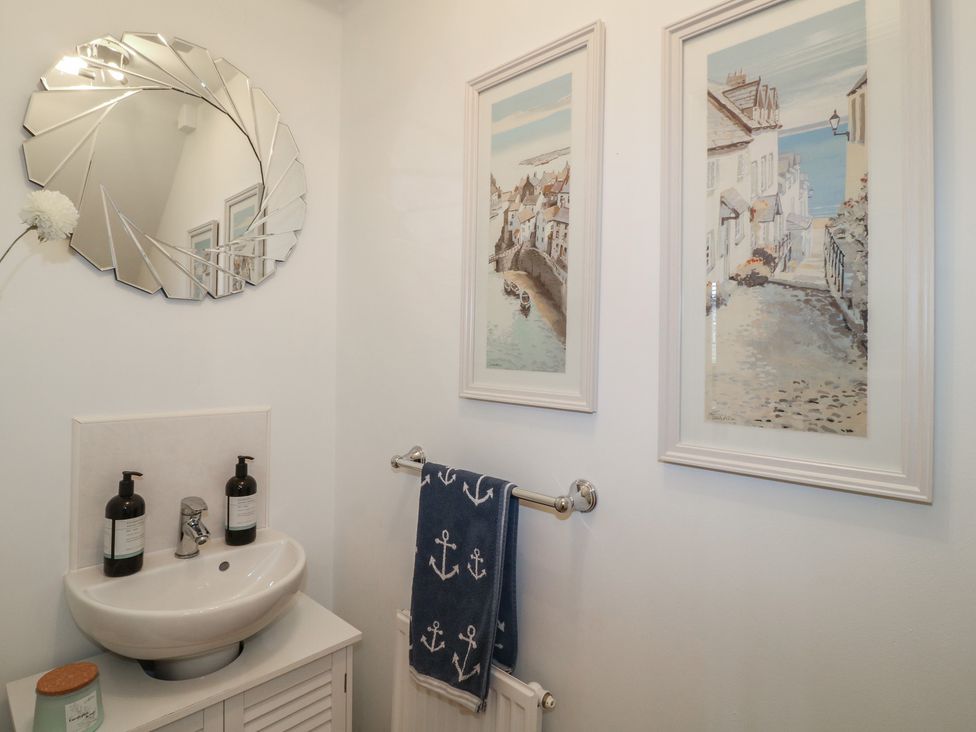 A bathroom with a sink and mirror at 7 Yarnfield Parkway