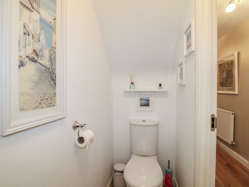 A bathroom featuring a toilet and decorative shelf at 7 Yarnfield Parkway