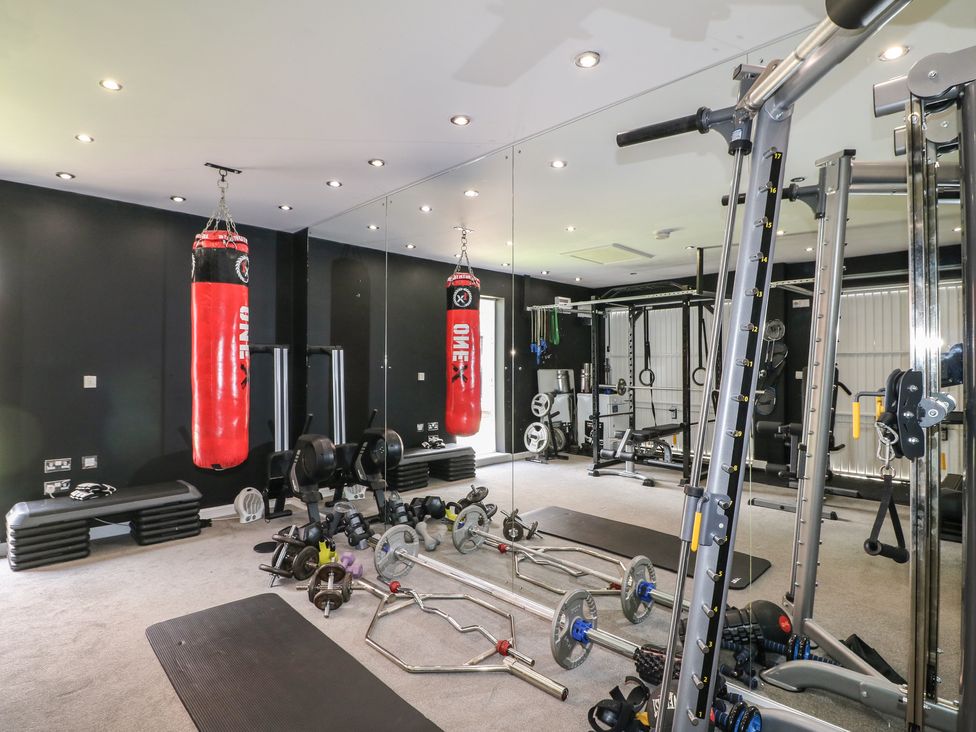 A gym with various workout equipment at 7 Yarnfield Parkway