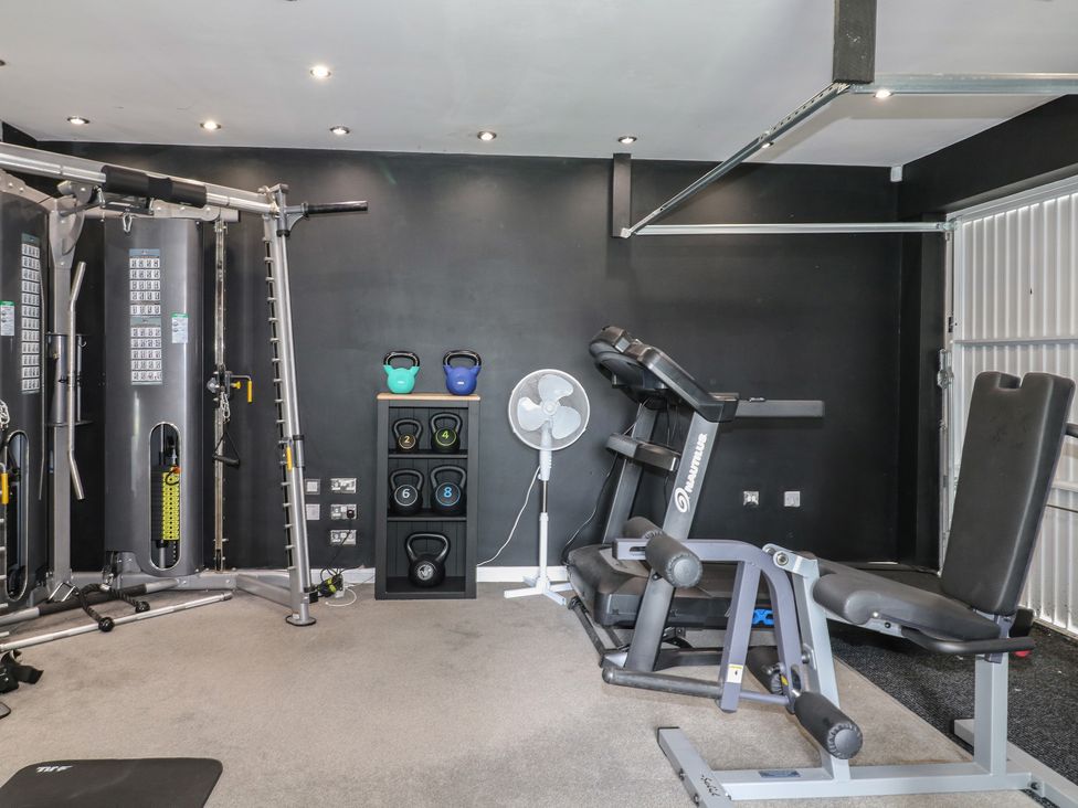 A gym with exercise equipment and kettlebells at 7 Yarnfield Parkway