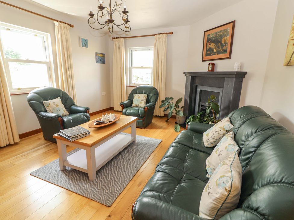 A living room with sofa and armchairs at Ash House in Ballyvaughan