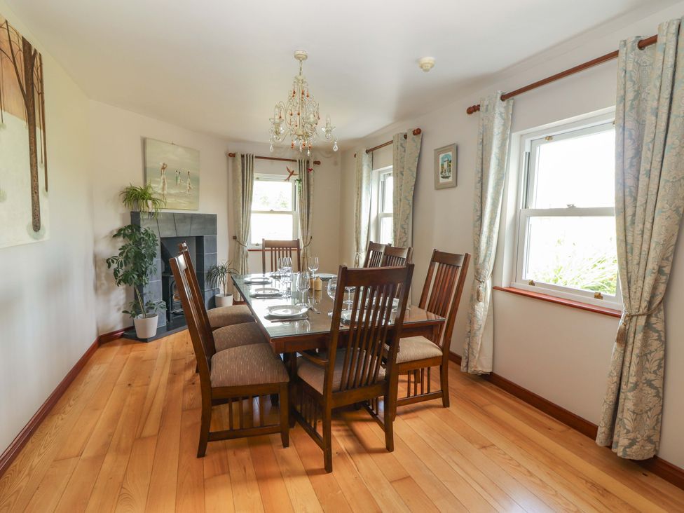 A dining room with a table and chairs at Ash House in Ballyvaughan
