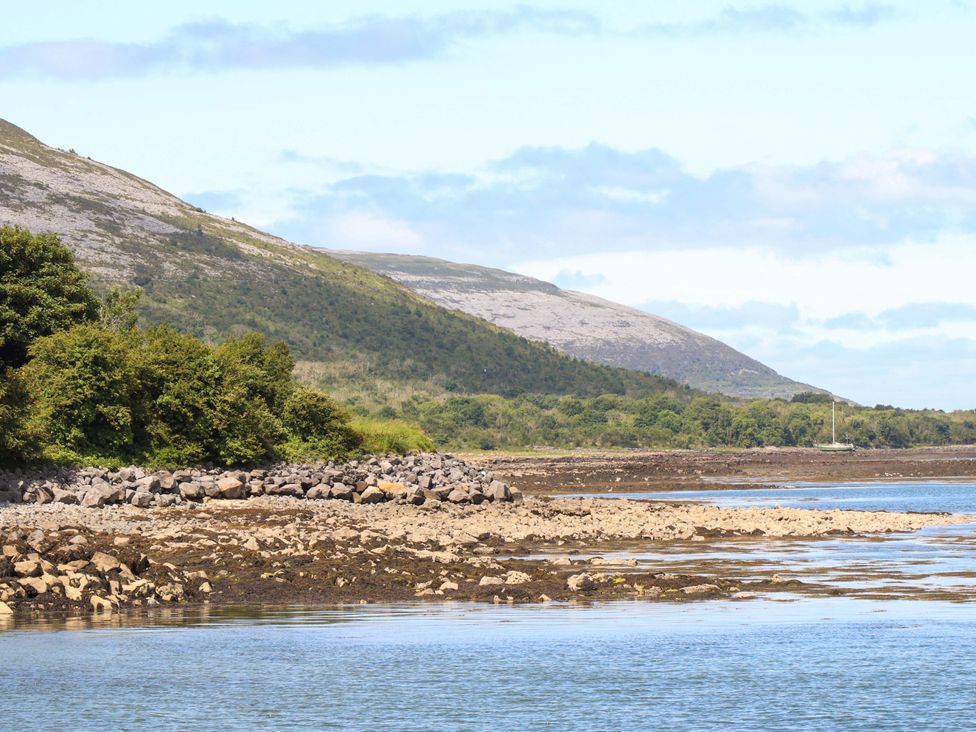 A scenic view of a mountain and water at Ash House Ballyvaughan