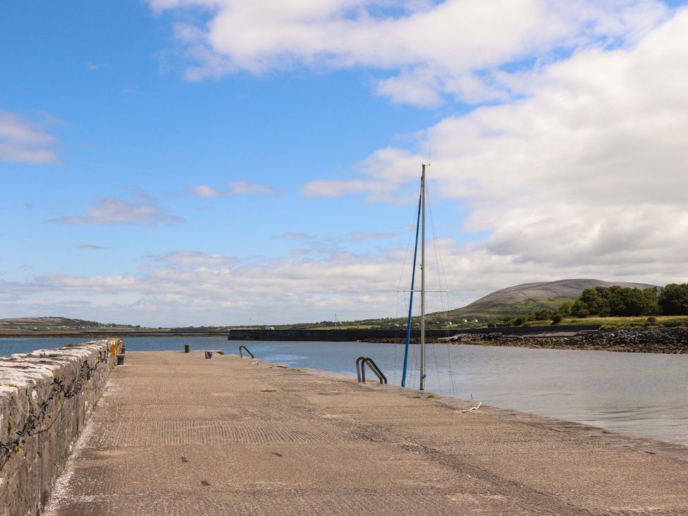 A pier with a sailboat at Ash House in Ballyvaughan