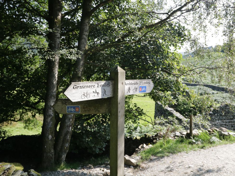 A signpost indicating directions to Grasmere and Ambleside in Troutbeck Bridge near Windermere