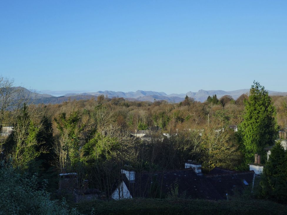 A view of mountains and trees from the property at School Cottage, Troutbeck Bridge near Windermere