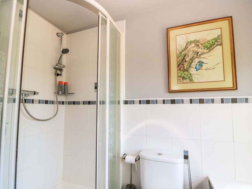 A bathroom with a shower and toilet at The White House in Piddletrenthide