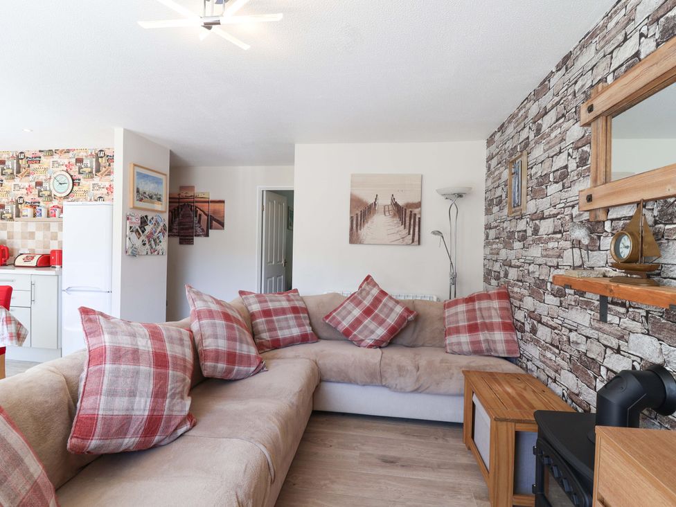 A living room with a sofa and coffee table at Boo’s Bungalow in Callington near Gunnislake