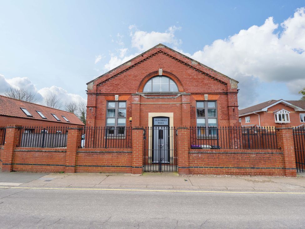 A brick building with a gated entrance at 3 The Old Drill Hall Alford