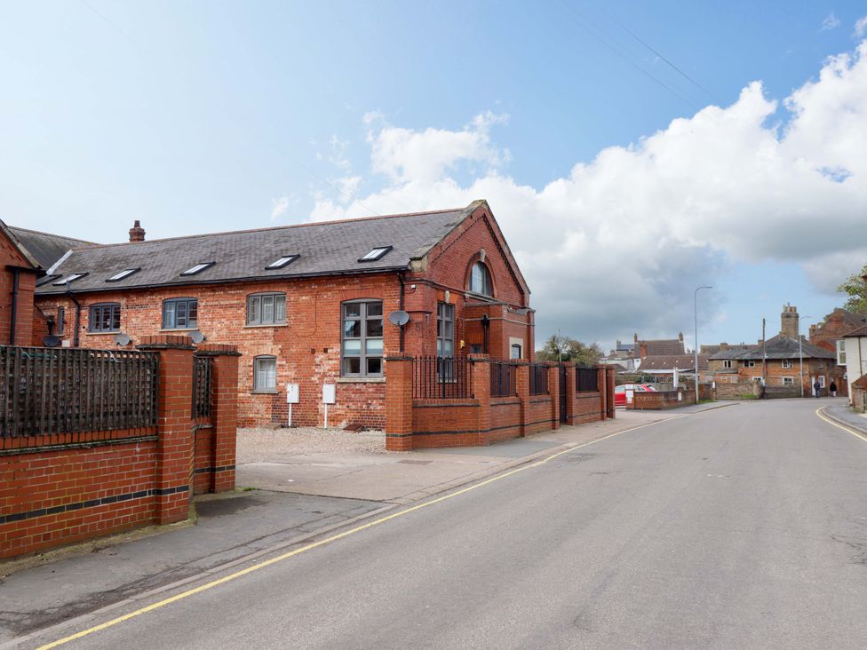 An exterior view of a building with brick walls at 3 The Old Drill Hall, Alford