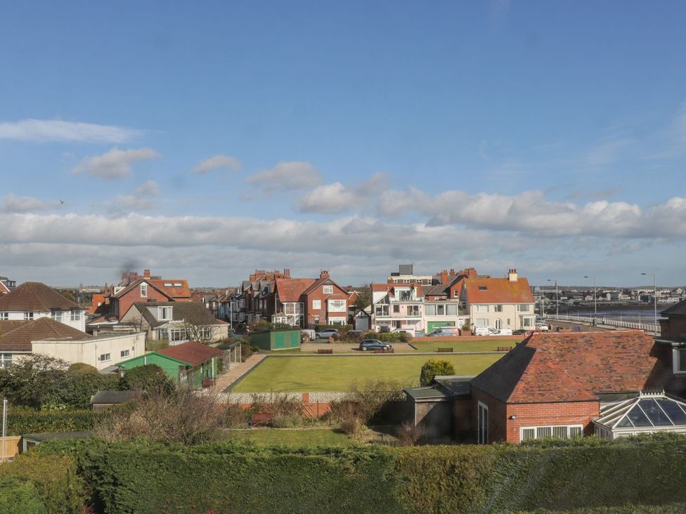 A view of houses and grass with a road in Bridlington