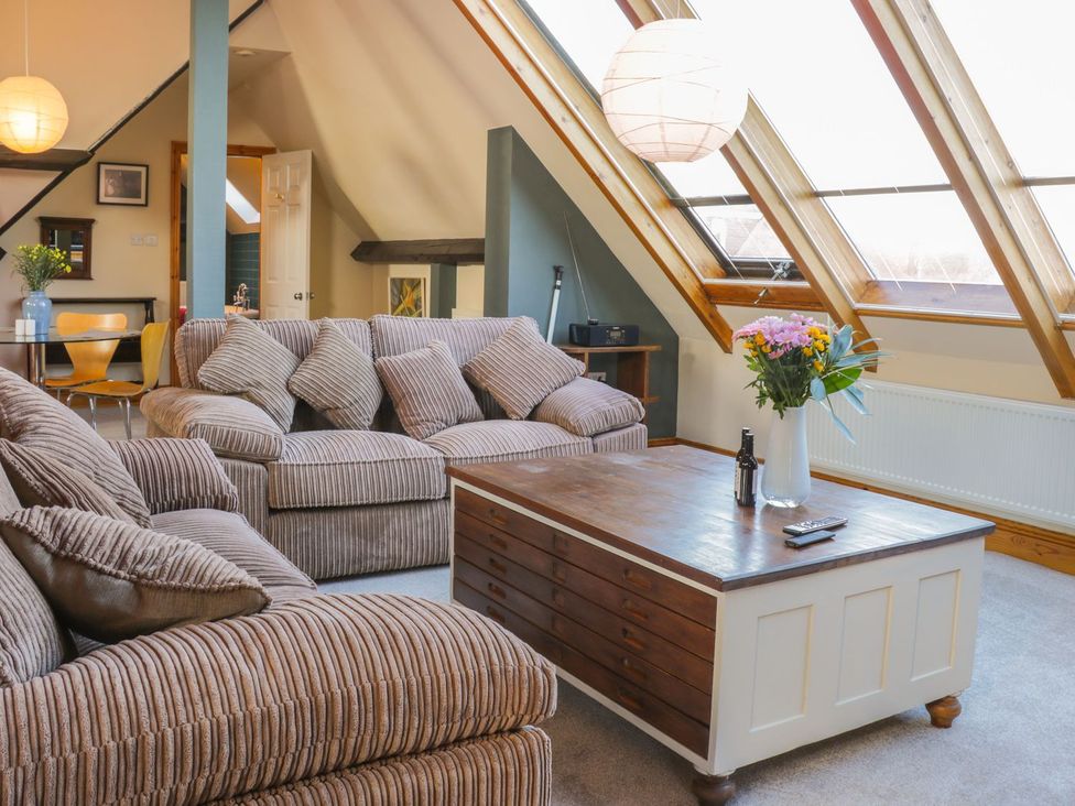 A living room with a sofa and coffee table at Atelier in Bridlington
