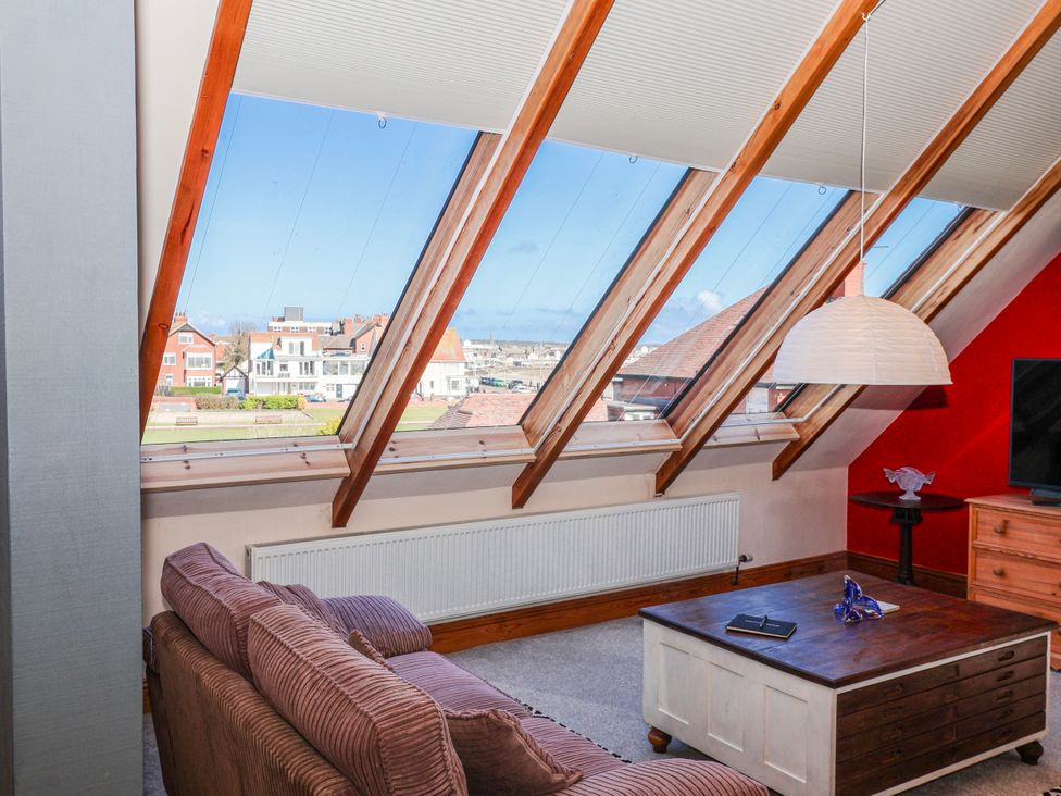 A living room with a sofa and table at Atelier in Bridlington