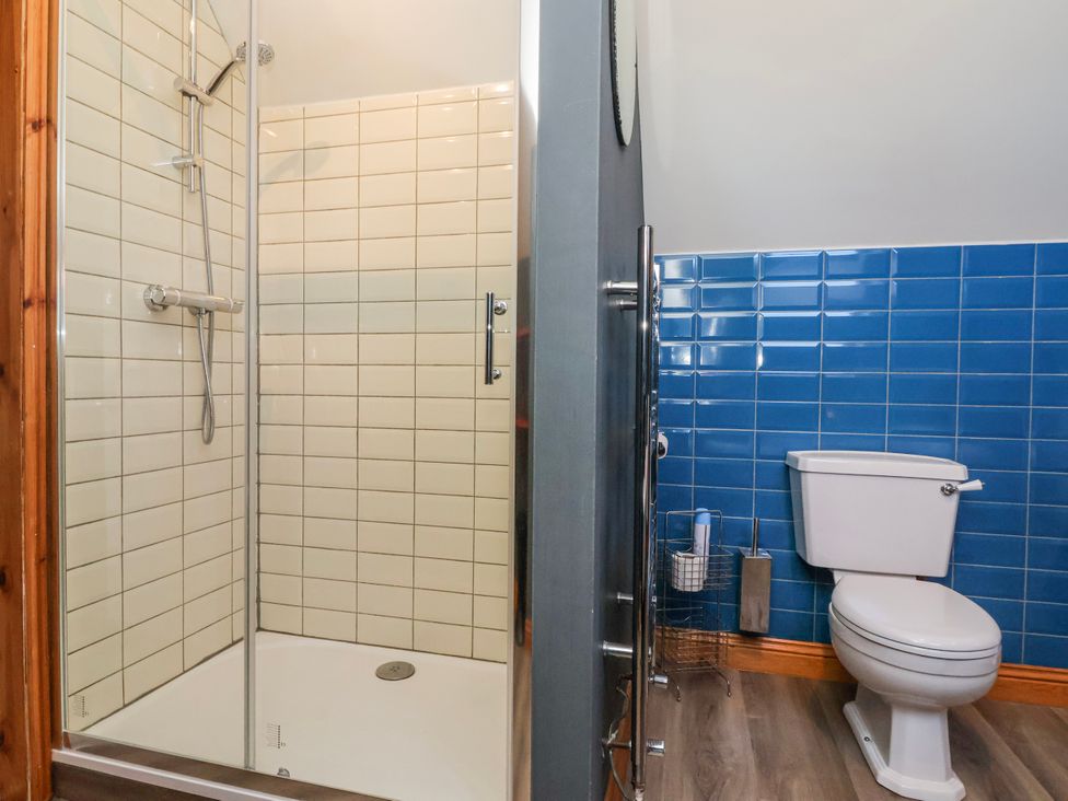 A bathroom with a shower and toilet at Atelier in Bridlington