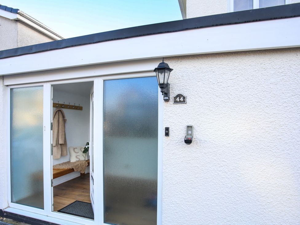 An entrance with a door and coat hooks at Penrhos Walks Holyhead