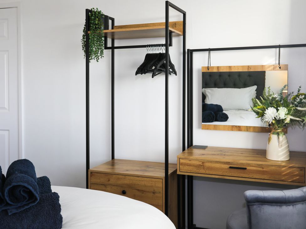 A bedroom with a bed and furnishings at Penrhos Walks in Holyhead