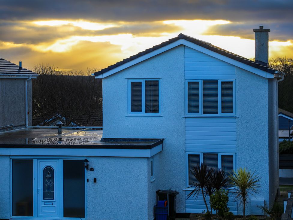 A house with a garden and sunset at Penrhos Walks in Holyhead
