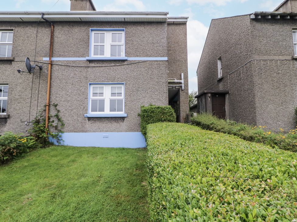 An exterior view of a building with windows and bushes at Burna in Letterkenny