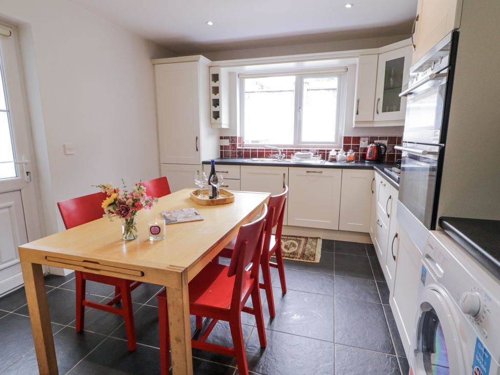 A kitchen with a table and chairs at Burna in Letterkenny