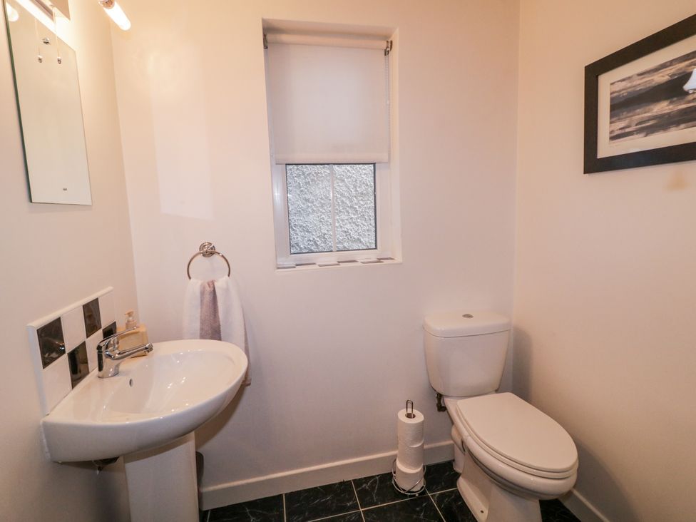 A bathroom with a sink and toilet at Burna in Letterkenny
