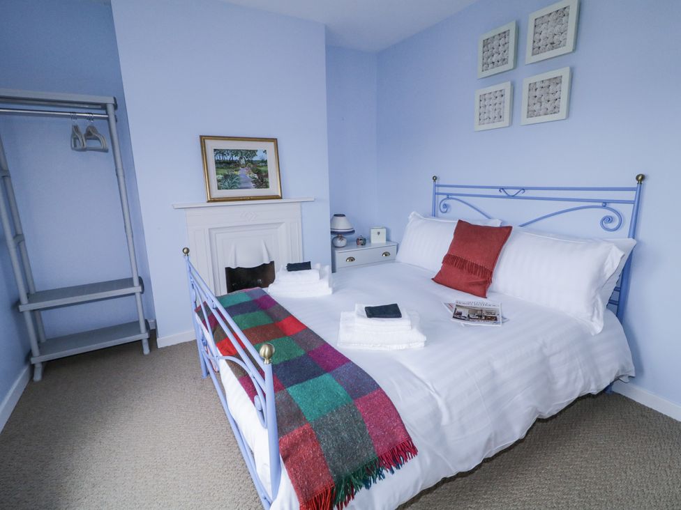 A bedroom with a bed and side table at Burna in Letterkenny