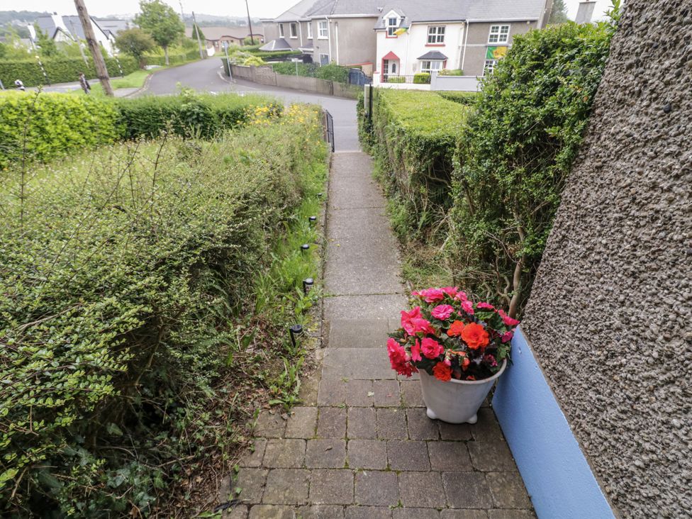 A walking path with a flower pot at Burna in Letterkenny