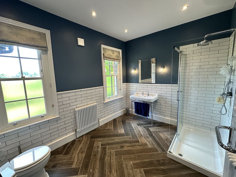 A bathroom with a sink and shower at The Old Vicarage in 