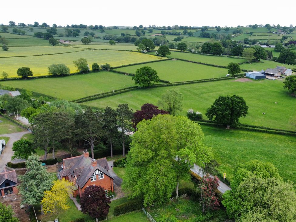 Aerial view of fields and a house at The Old Vicarage