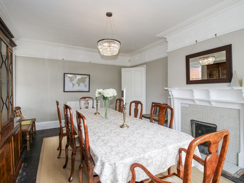 A dining room with a table and chairs at The Old Vicarage in Kimbolton near Leominster