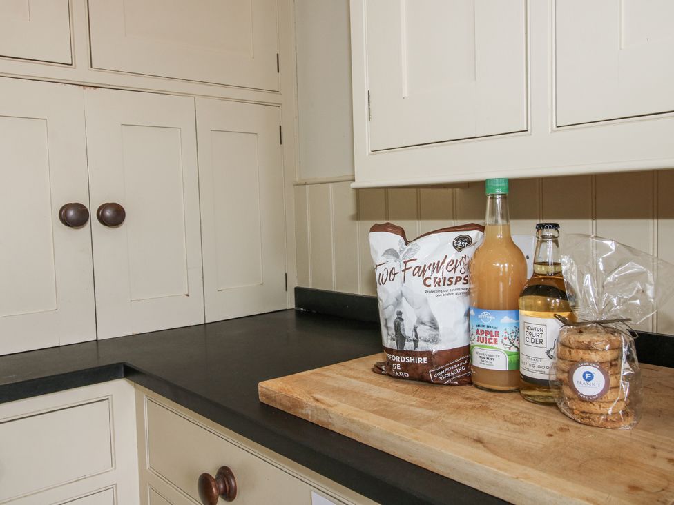 A kitchen counter with snacks and drinks at The Old Vicarage Kimbolton near Leominster