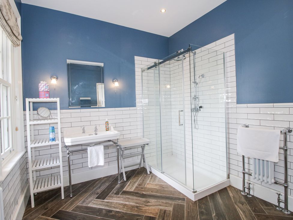 A bathroom with a shower and sink at The Old Vicarage in Kimbolton near Leominster
