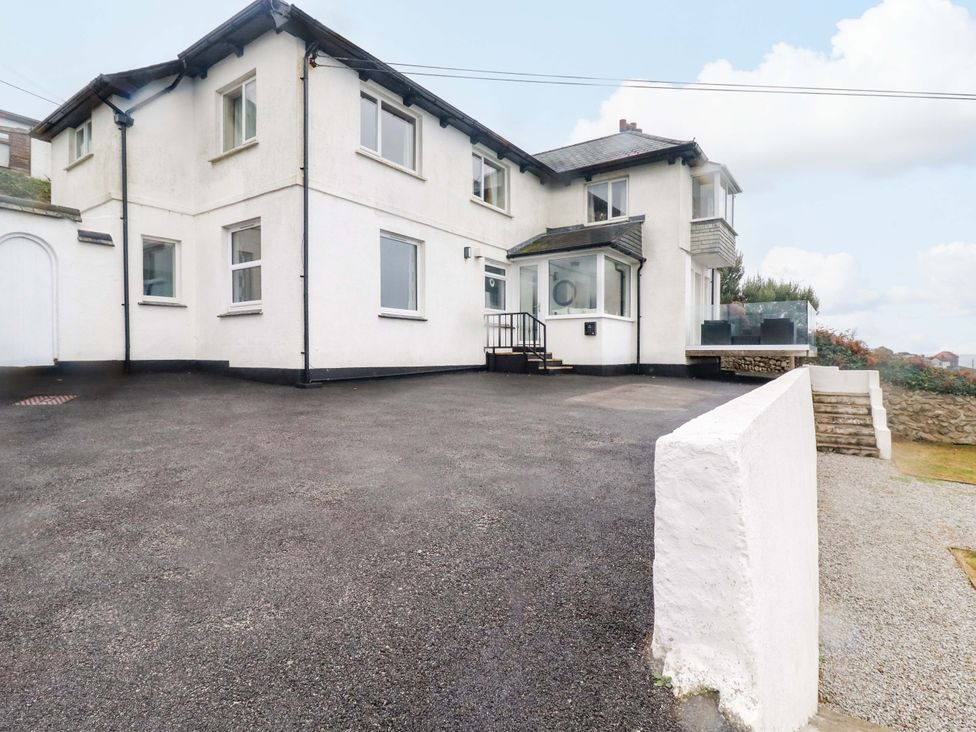A house with a driveway and front steps at Ocean Edge Sennen Cove