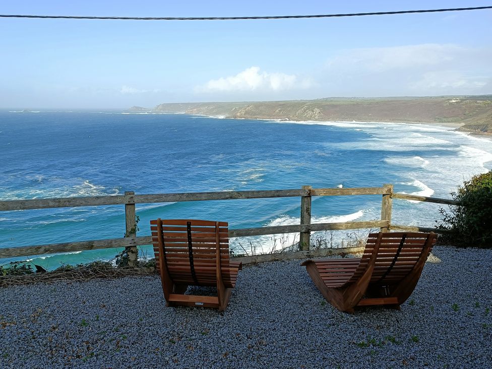 Two chairs overlooking the ocean at Ocean Edge in Sennen Cove