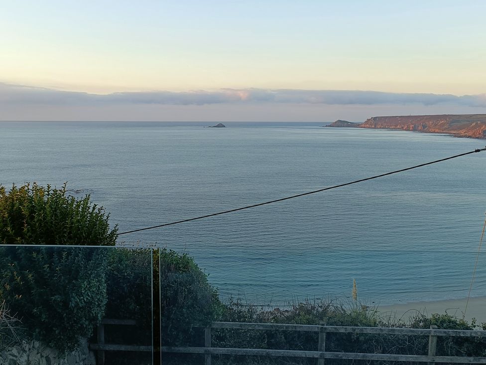 A view of the ocean and coastline at Ocean Edge in Sennen Cove