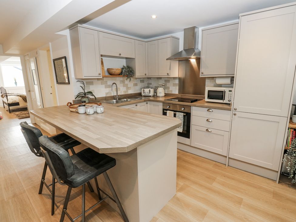 A kitchen with cabinets and appliances at Apartment 5 in Skipton