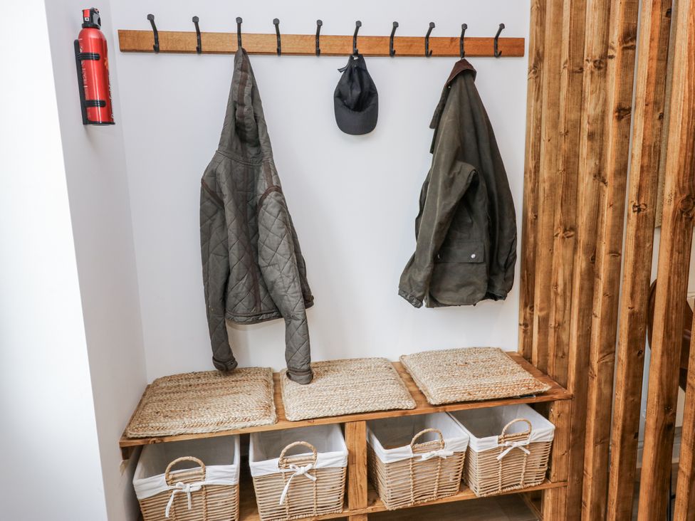 An entrance area with hooks and baskets at Apartment 5 in Skipton