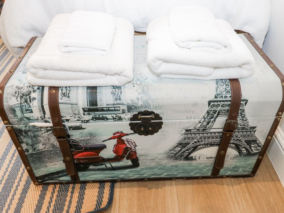 A trunk with towels on top at Apartment 5 in Skipton