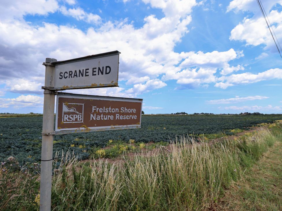 A signpost indicating Scrane End and Frelston Shore Nature Reserve