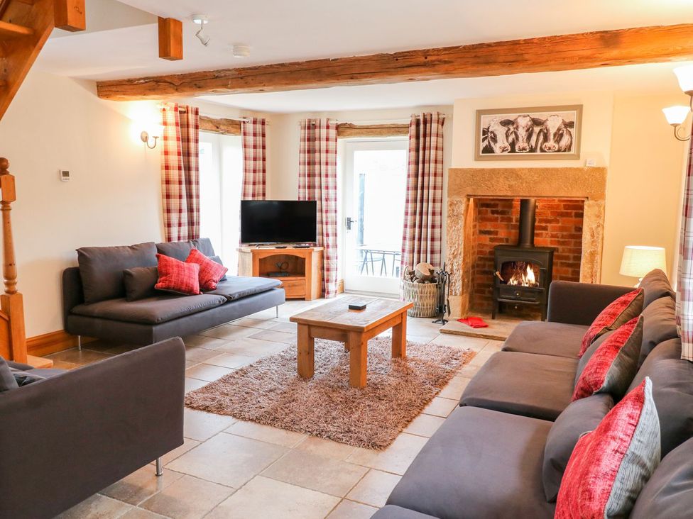 A living room with sofas and a coffee table at The Barn in Wirksworth