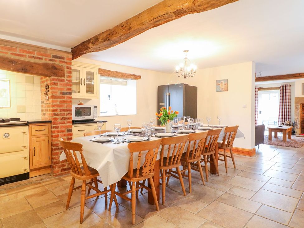 A dining area with a table and chairs at The Barn in Wirksworth