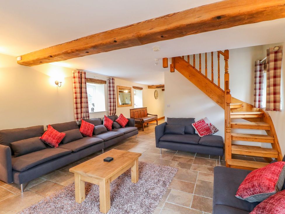 A living room with sofas and a coffee table at The Barn in Wirksworth
