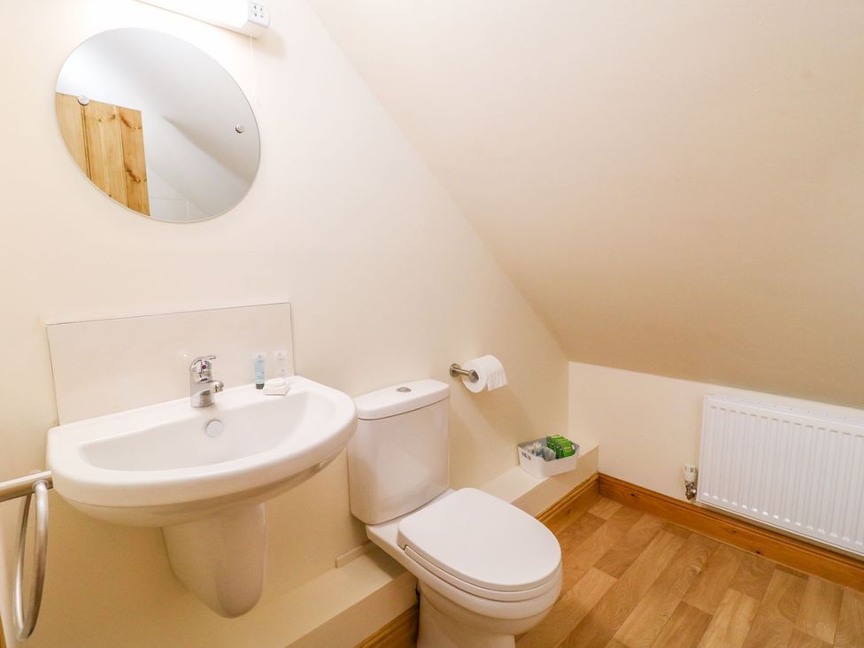 A bathroom with a sink and toilet at The Barn in Wirksworth