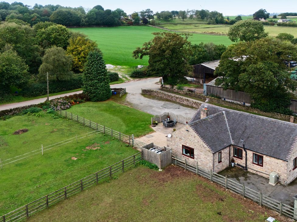 An outdoor view of a house with a garden at The Lodge in Wirksworth