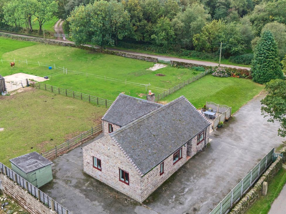 An aerial view of a house with a grassy area at The Lodge in Wirksworth