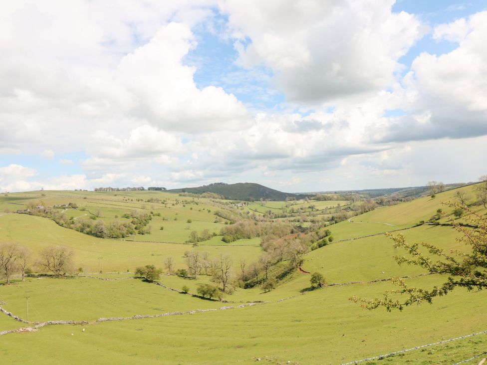 A view of hills and fields with clouds at The Lodge in Wirksworth