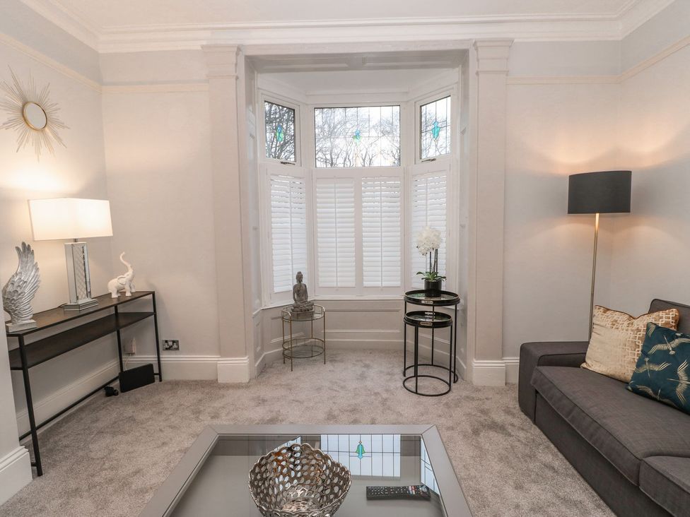 A living room with a sofa and coffee table at 16 Seafield Terrace in South Shields