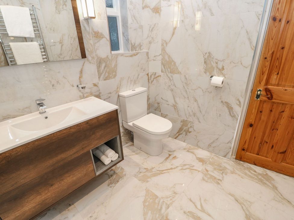 A bathroom with a sink and toilet at 16 Seafield Terrace in South Shields